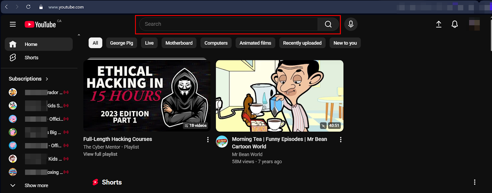 YouTube homepage in dark mode showing the search bar highlighted at the top, with recommended videos and navigation menu visible.